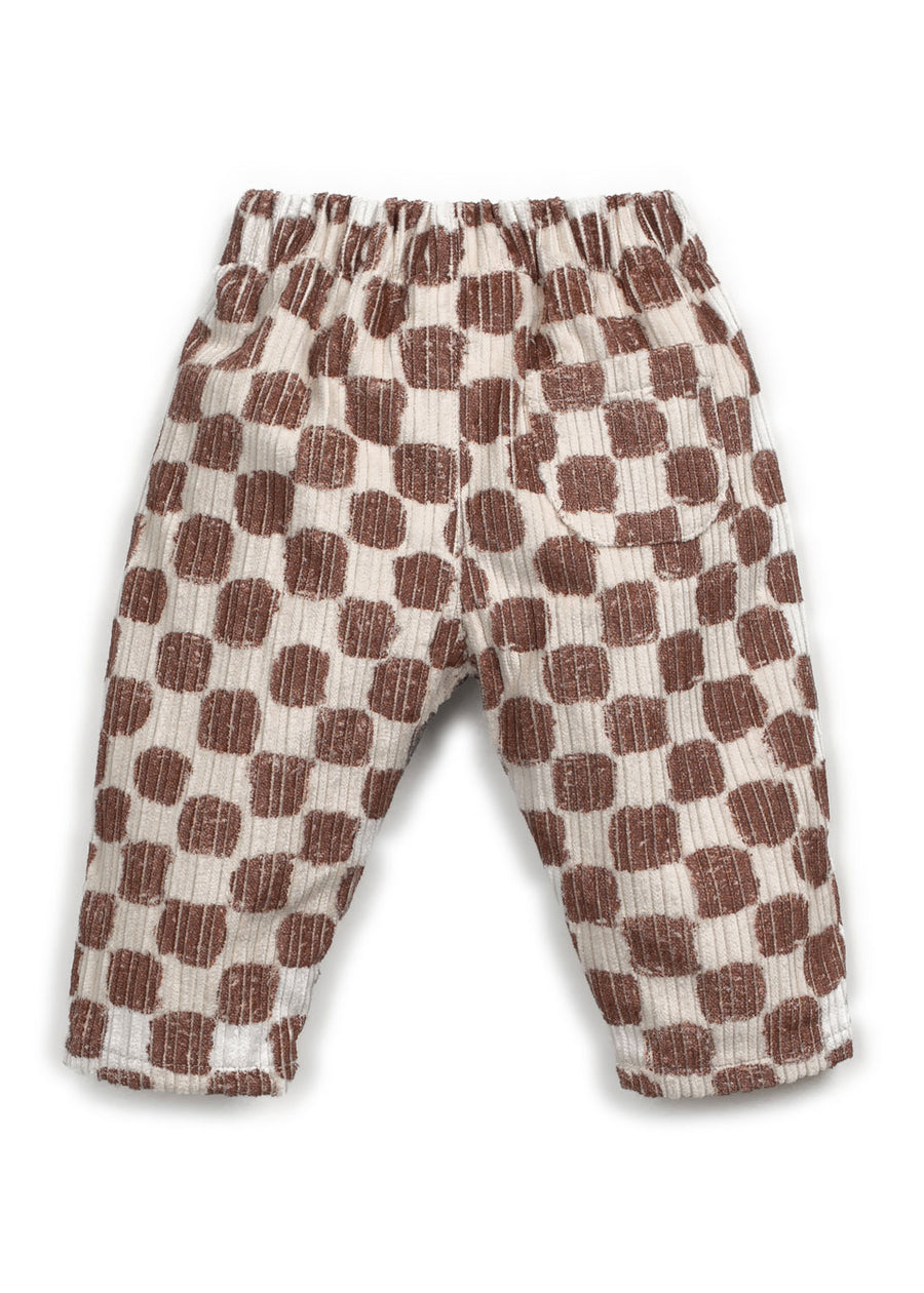 Checkered pants with brown and beige pattern on a white background
