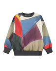 Colorful geometric-patterned sweater on a white background