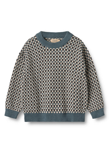 Patterned sweater with blue trim on a white background