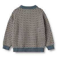 Patterned sweater with blue trim on a white background