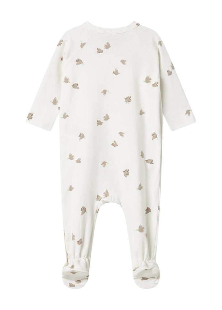 White baby onesie with small pattern on a white background