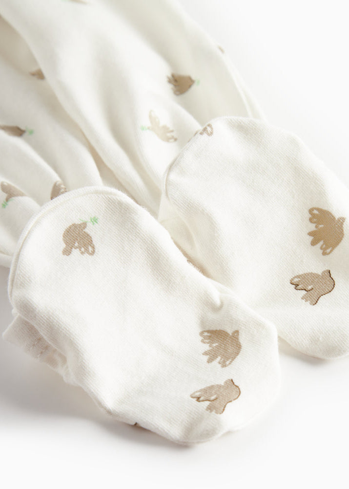 White fabric with gold dove prints on a white background