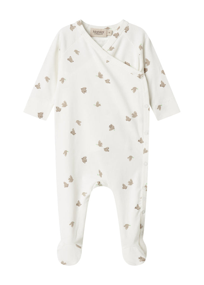 White baby onesie with small patterns on a white background