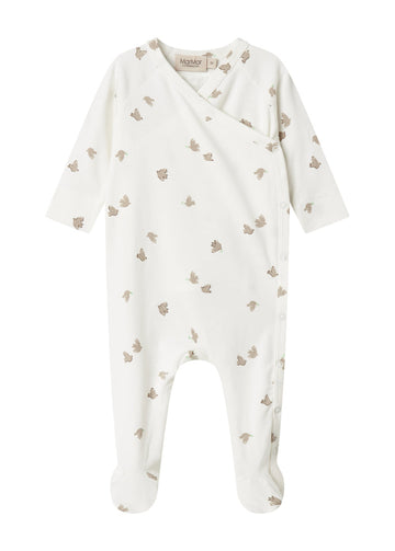 White baby onesie with small patterns on a white background