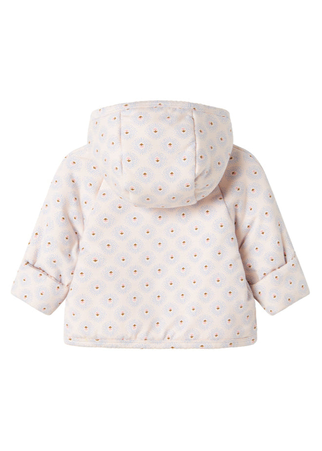 White puffer jacket with small patterns on a white background