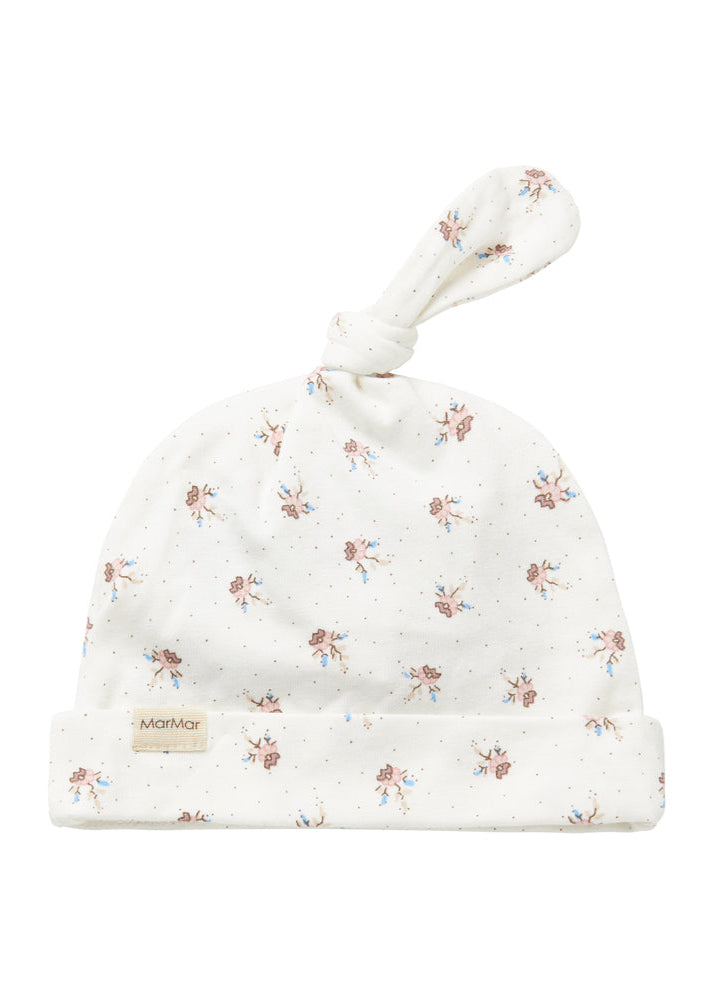 Floral-patterned baby hat with a soft texture on a white background