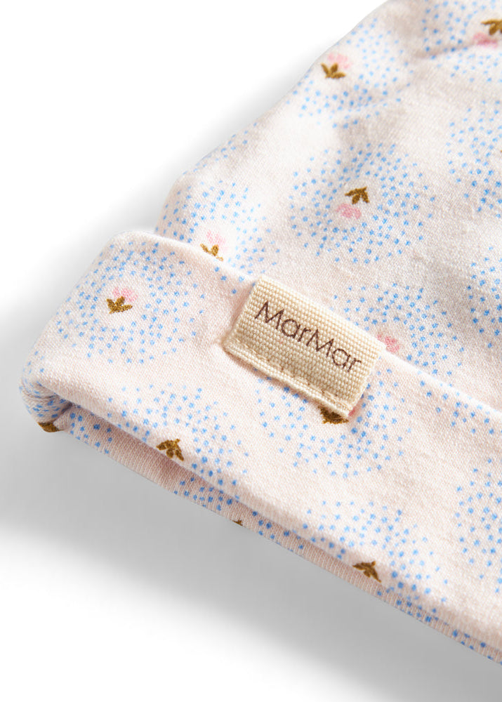 Floral patterned blanket with a Marmar label on a white background