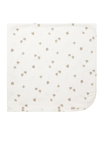White baby blanket with small brown floral pattern on a white background