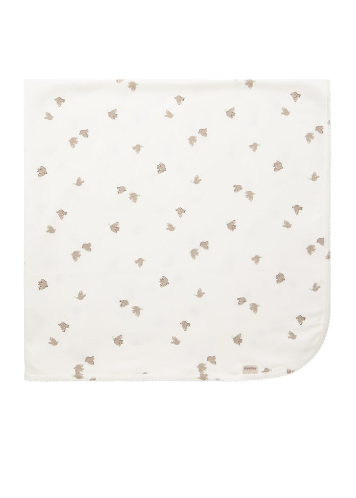 White baby blanket with small brown floral pattern on a white background