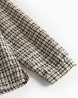 Folded checkered fabric on a white background