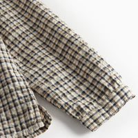 Folded checkered fabric on a white background