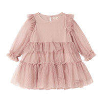 Pink dress with ruffled sleeves and layers on a white background