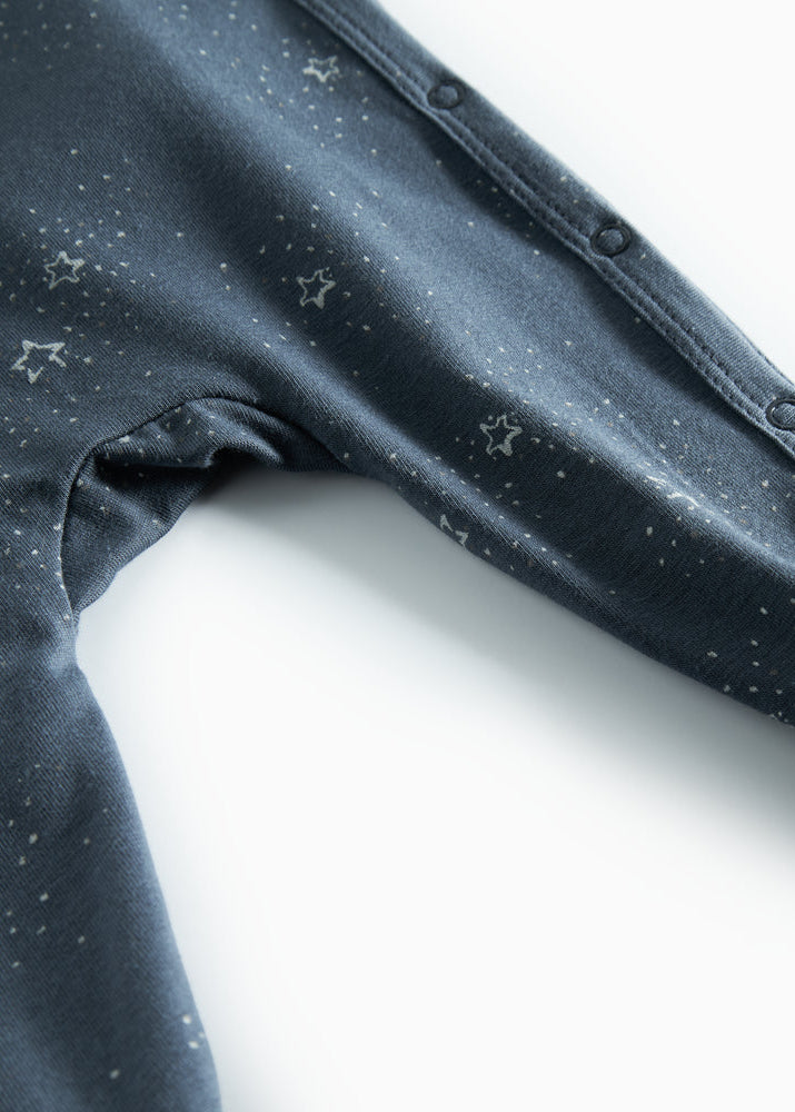 Close-up of dark fabric with star patterns on a white background