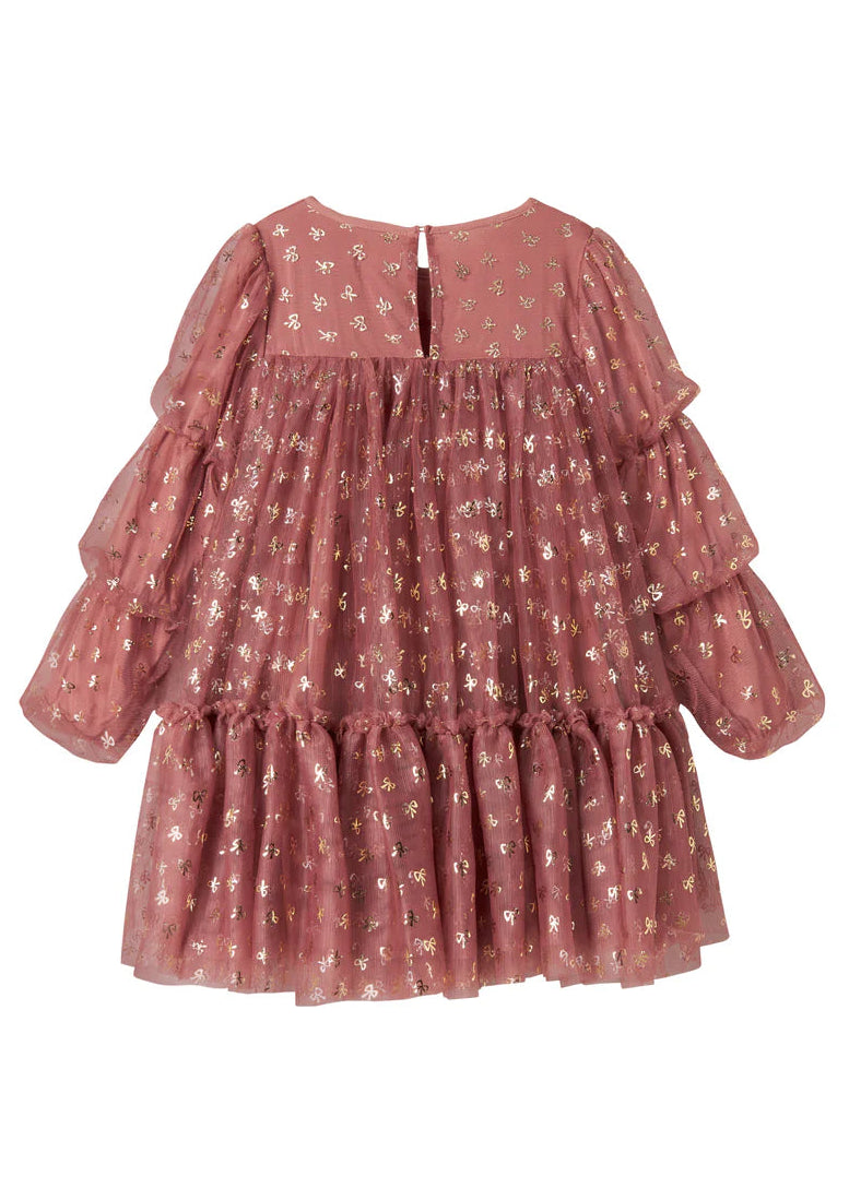 Pink tiered dress with floral pattern on a white background