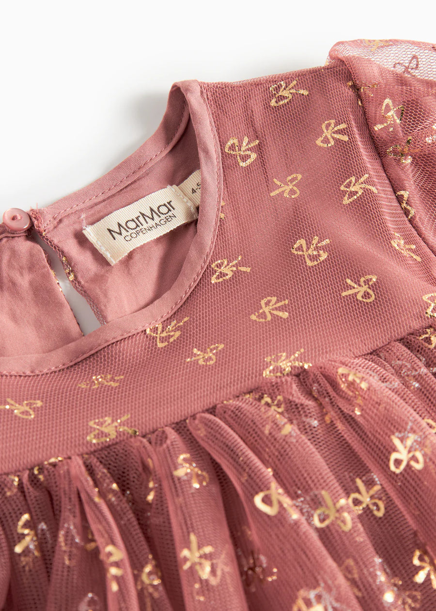 Pink dress with gold butterfly patterns and a visible brand label on a white background