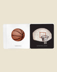 Illustrated book with images of a basketball and a basketball hoop on beige background