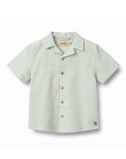 Green and white checkered shirt on a white background