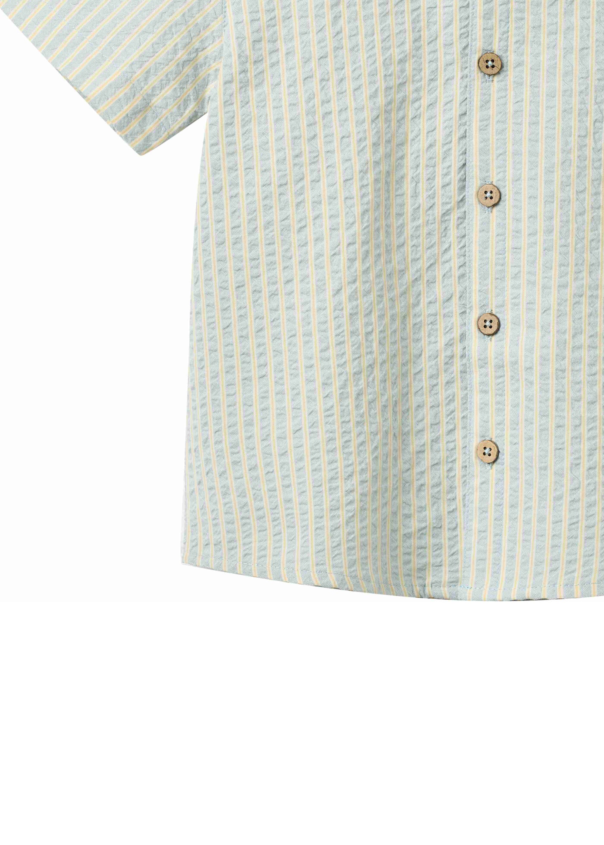 Close-up of a short-sleeve shirt with a striped pattern and wooden buttons on a white background