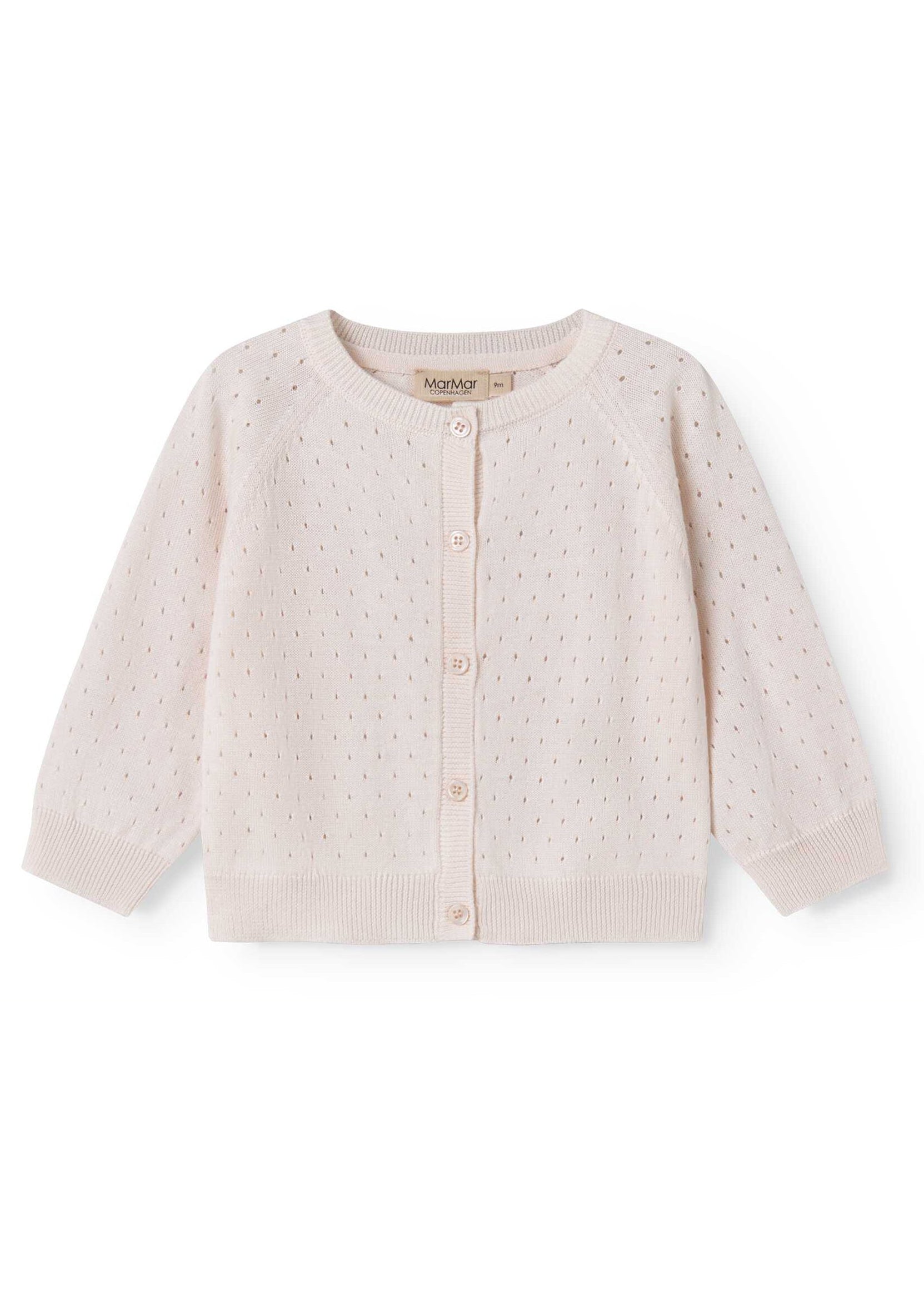 Baby cardigan with button details on a white background