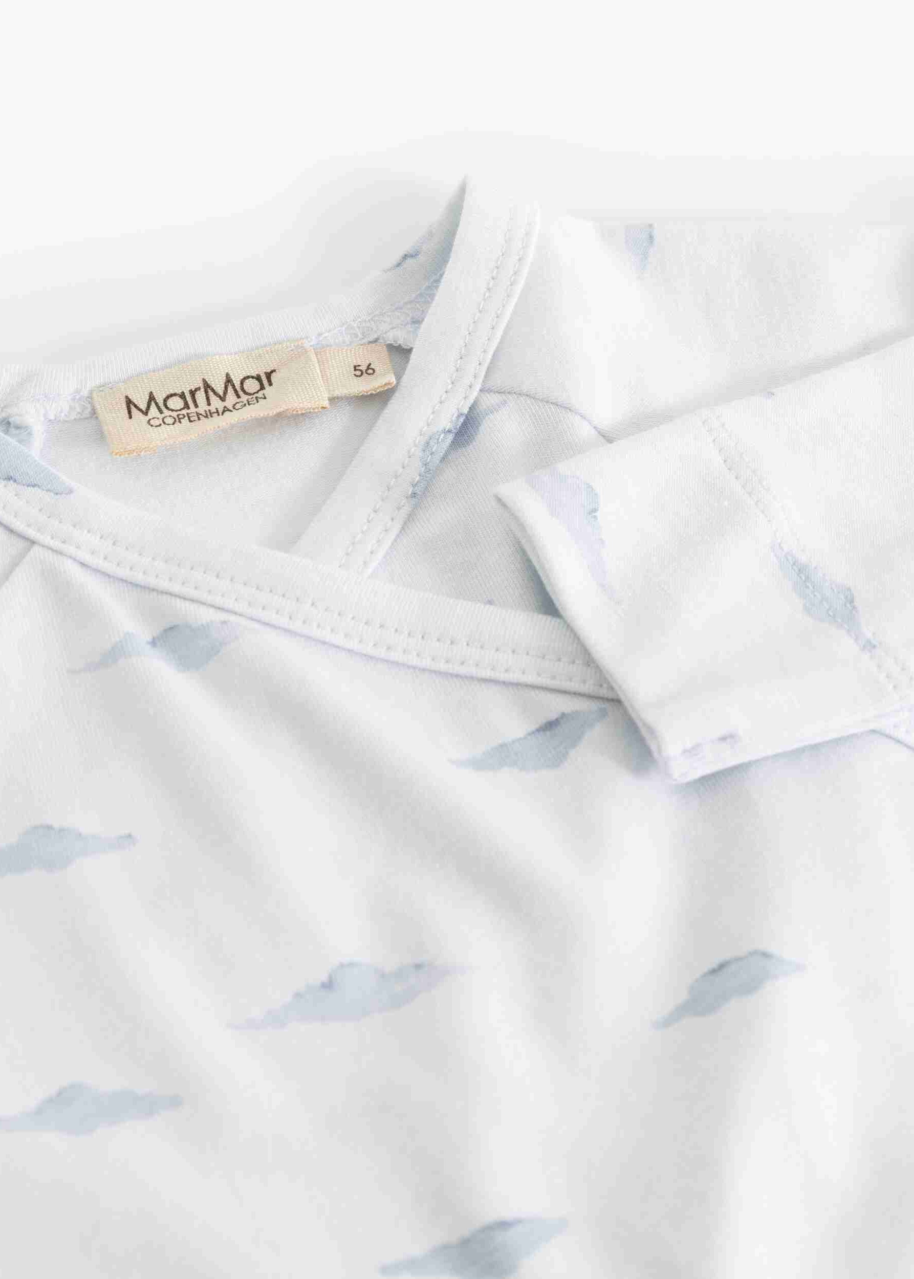 White shirt with blue whale pattern and MarMar Cph label on a white background