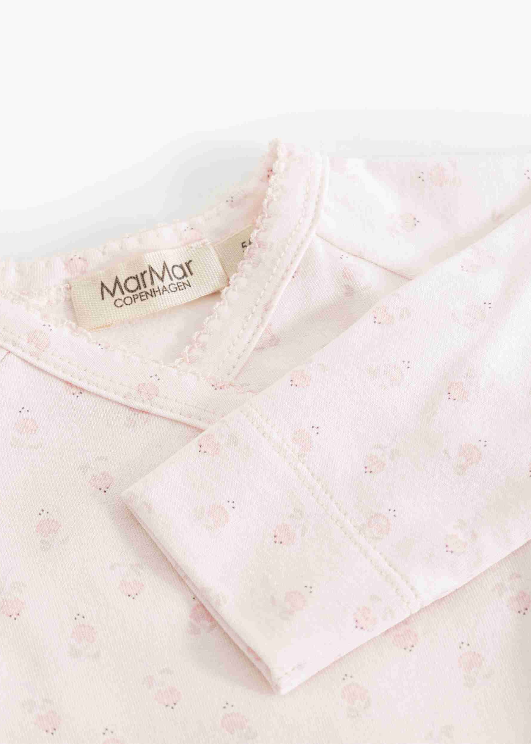 Pink baby blanket with floral pattern and 'MarMar Copenhagen' label on a white background