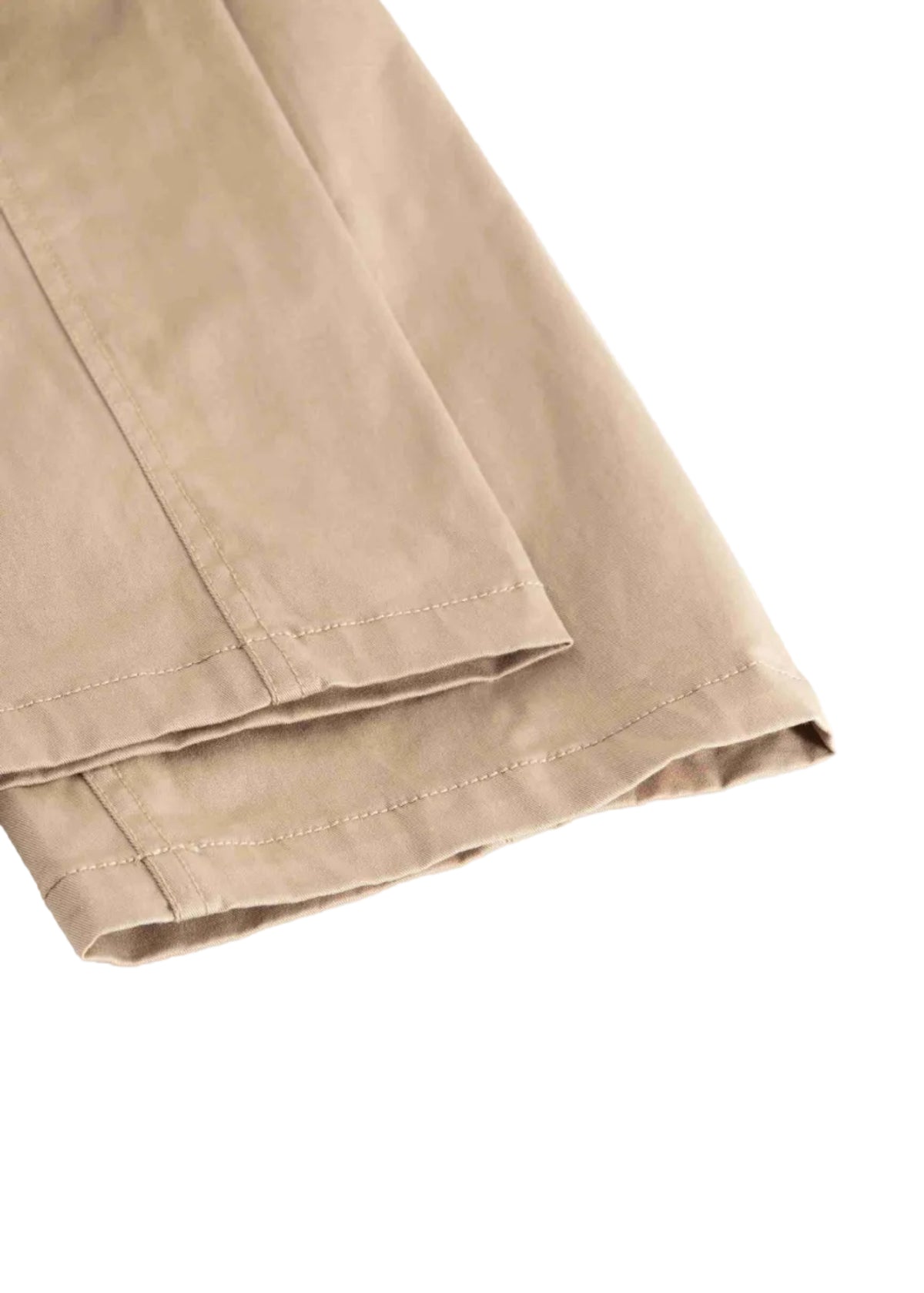 Close-up of folded khaki fabric with visible stitching and hem, shown on a plain white background.