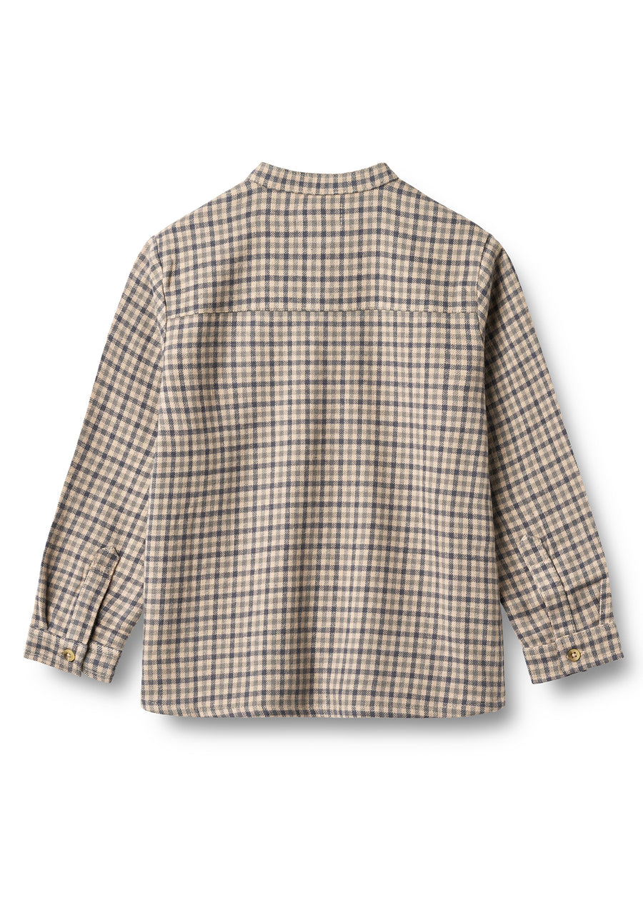 Back view of a plaid shirt on a white background
