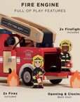Toy fire engine with firefighters and flames on a beige background