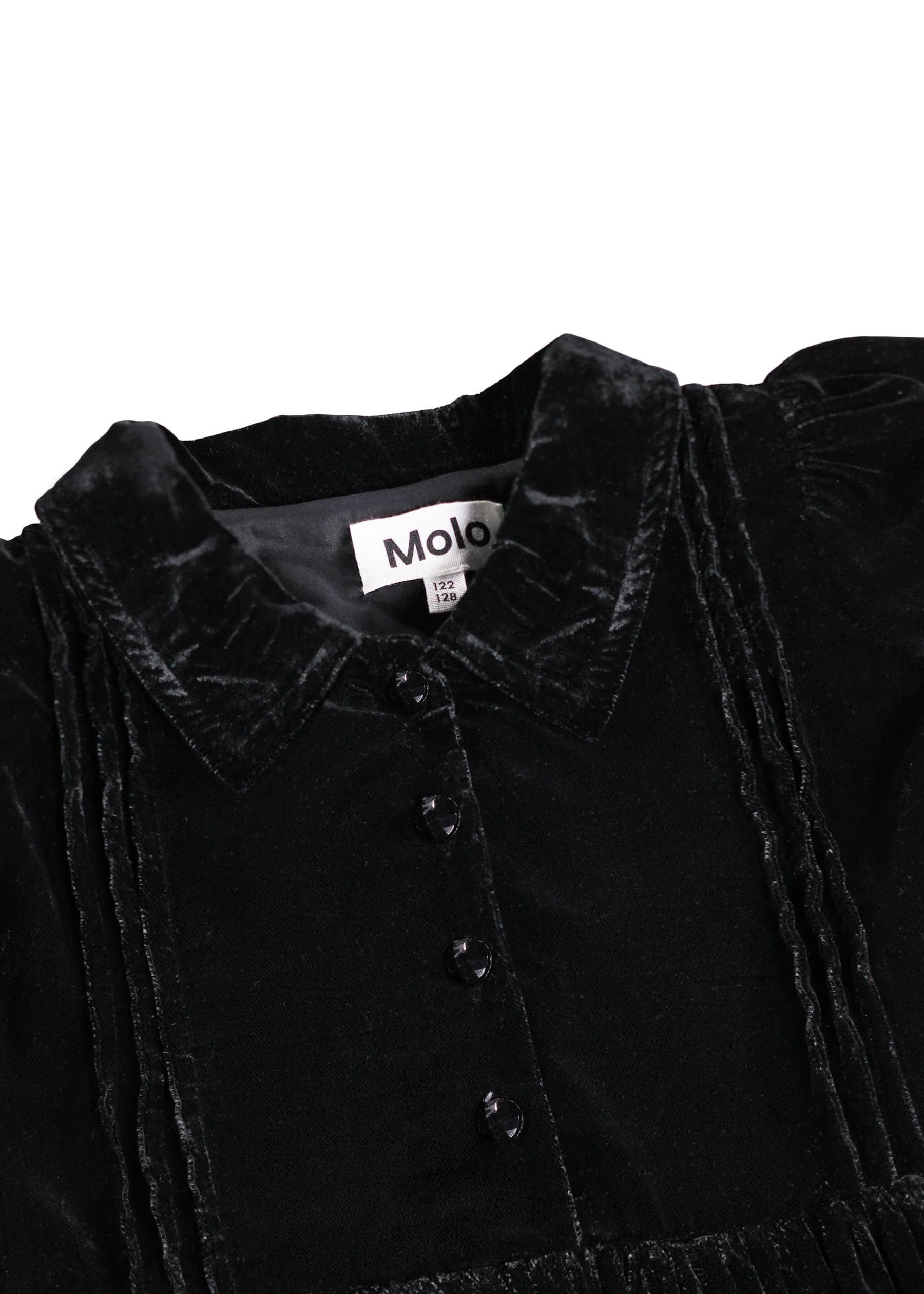 Black velvet garment with a visible brand label on a white background