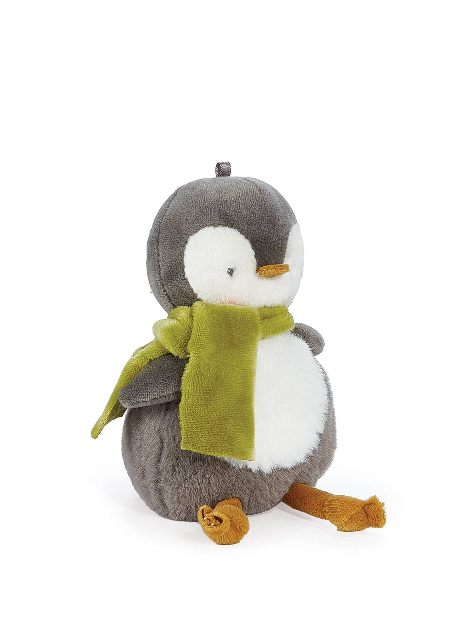 Stuffed penguin toy with a green scarf on a white background