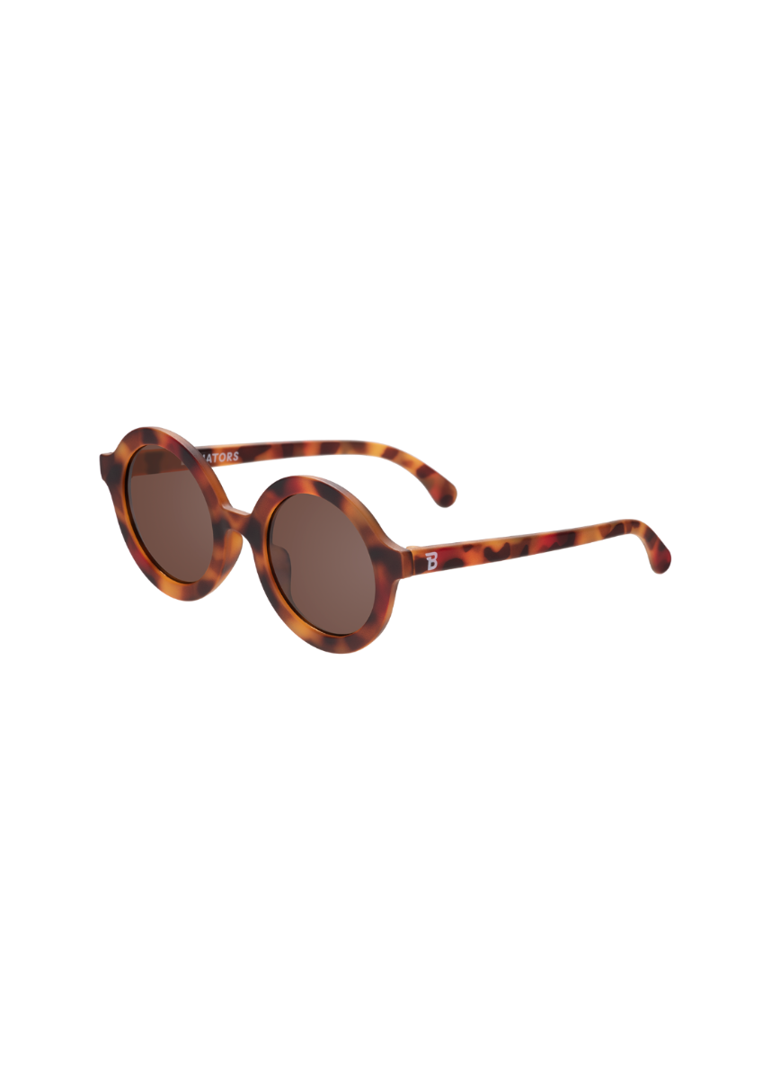 Sunglasses with tortoiseshell frame and dark lenses on a white background