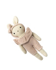 Knitted toy rabbit with a pink outfit on a white background