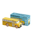 Yellow toy school bus with blue packaging labeled 'GT285 Rufus' on a beige background
