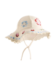 Beige sun hat with floral embellishments on a white background