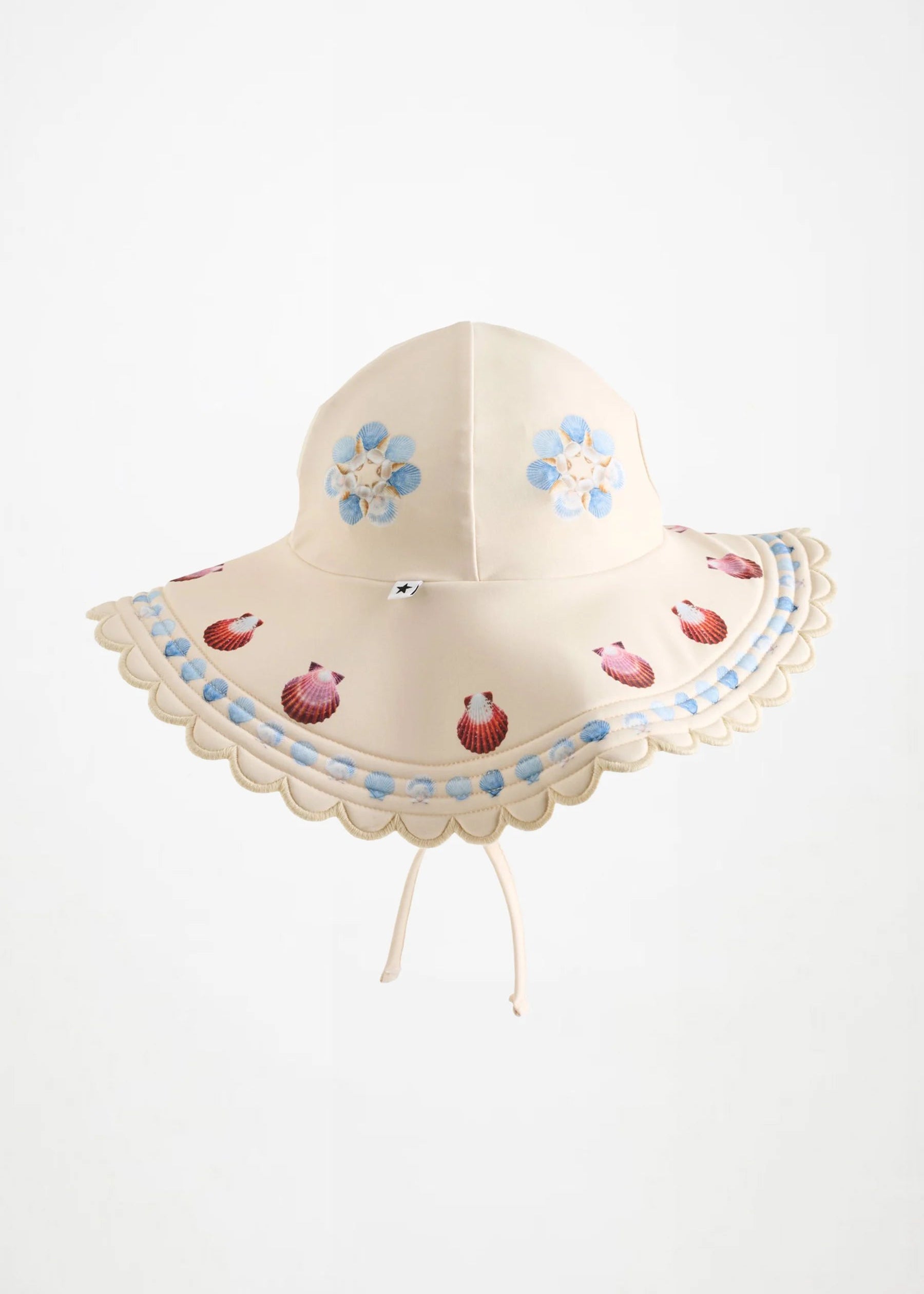 Children's sun hat with floral and seashell design on a white background