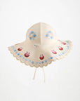 Children's sun hat with floral and seashell design on a white background