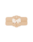 A small cream-colored fabric bow with tiny gold embroidered details, displayed on a brown kraft paper card labeled 'MINI BOW'.