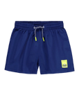 Blue swim shorts with a yellow label on a light gray background