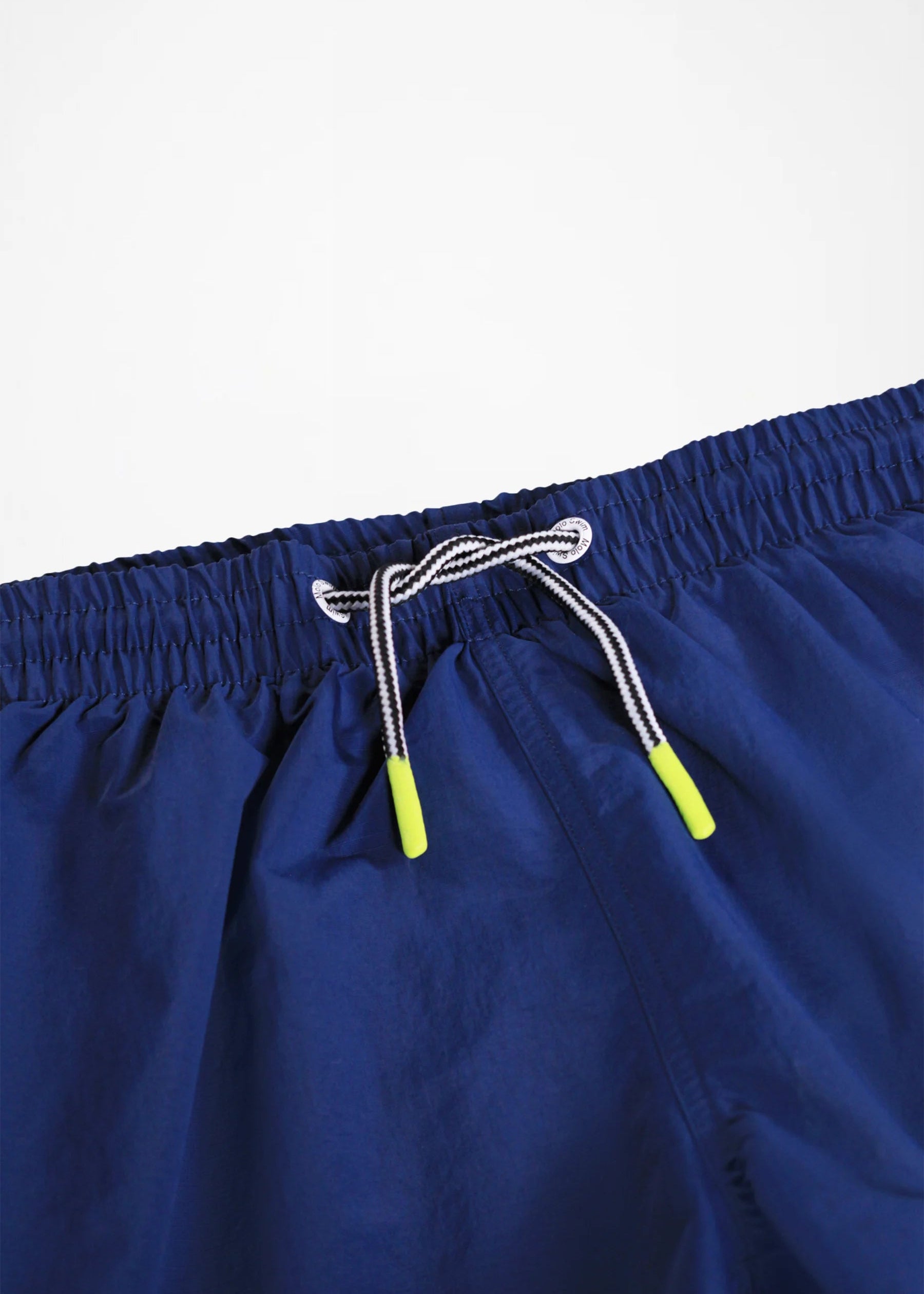 Navy blue shorts with a drawstring on a light gray background