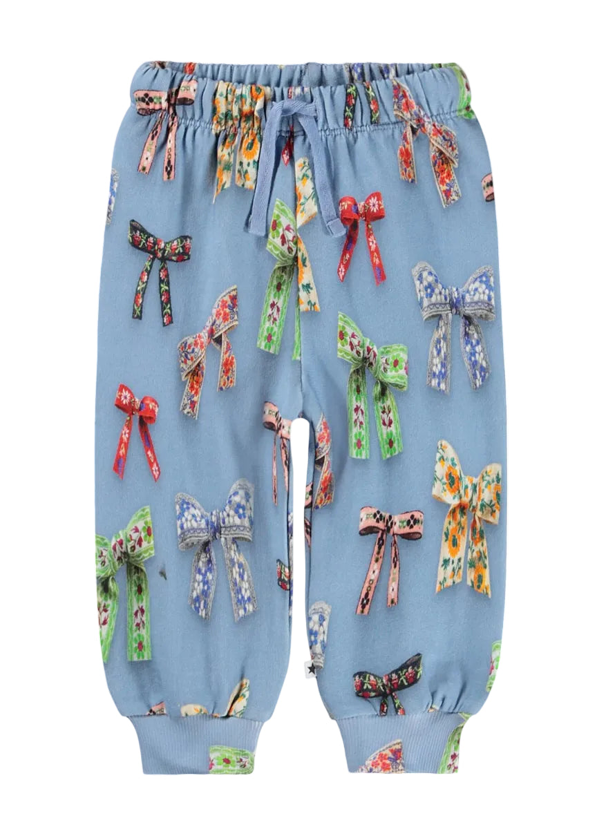Light blue jogger pants with an all-over bow print, featuring an elastic waistband with a drawstring and ribbed ankle cuffs.