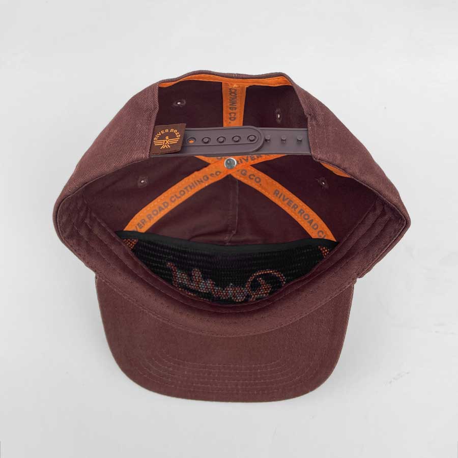 Brown cap with orange interior on a white background