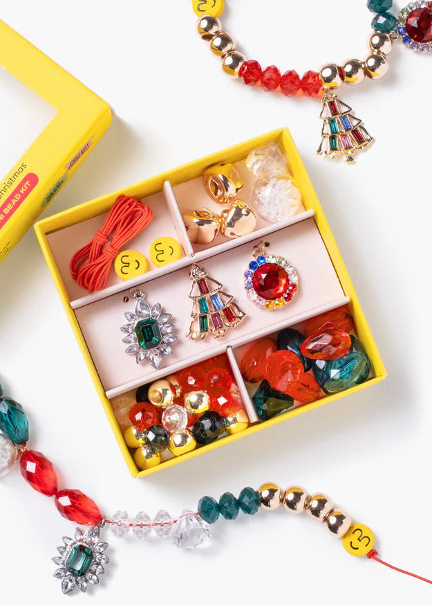 Colorful jewelry set with earrings and necklaces displayed in a yellow box on a white background.