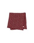 Folded fabric with small floral pattern on a white background