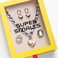 Children's jewelry set in a 'Super Smalls' box on a white background