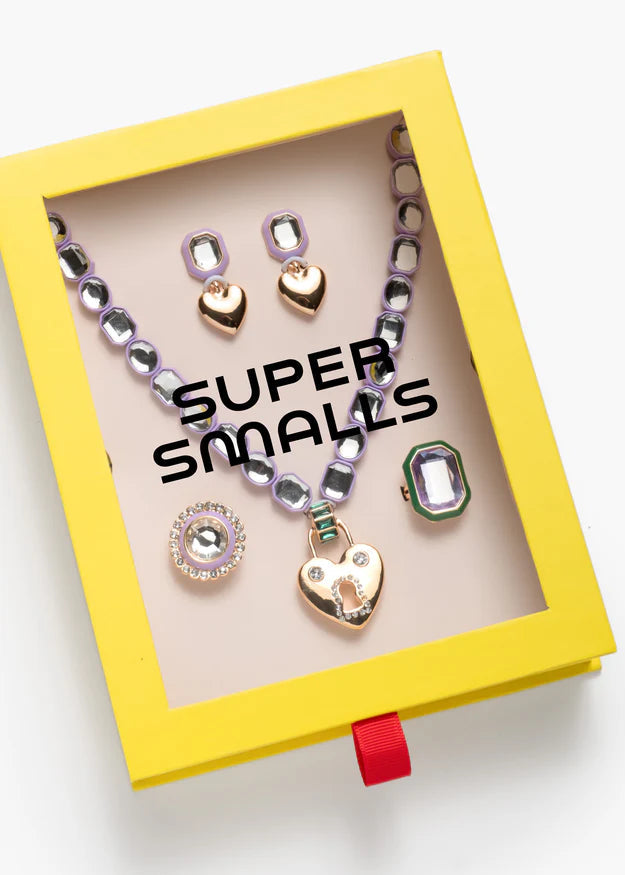 Children's jewelry set in a 'Super Smalls' box on a white background