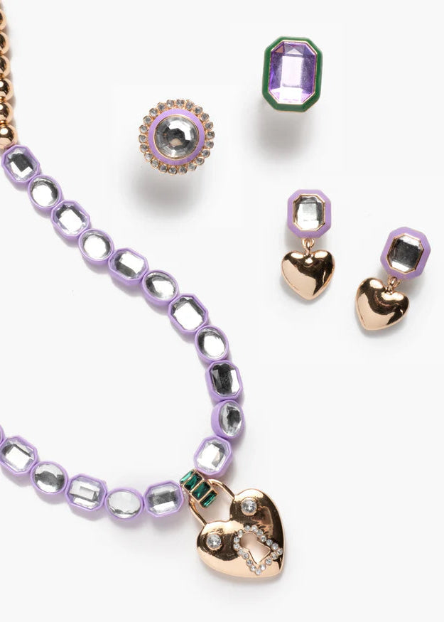 Jewelry set with heart-shaped pendants on a white background