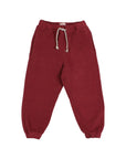 A pair of dark red jogger pants with an elastic waistband, a braided drawstring, and elastic cuffs, shown flat on a light gray background.