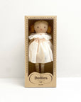 Toy doll in a cardboard box with 'Dollies' branding on a white background