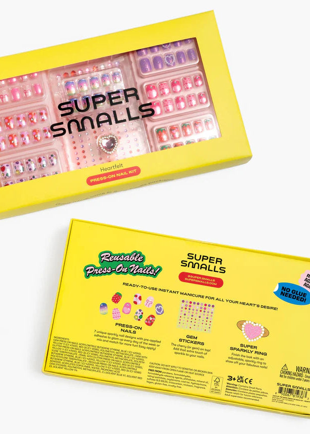 Super Smalls press-on nail kit packaging with yellow box and clear window