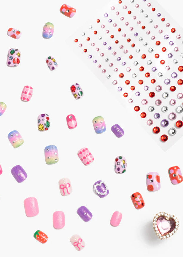 Collection of colorful nail art decorations on a white background
